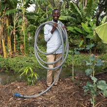 Load image into Gallery viewer, 32m roll of 25mm (1-inch) rigid discharge hose for SE1